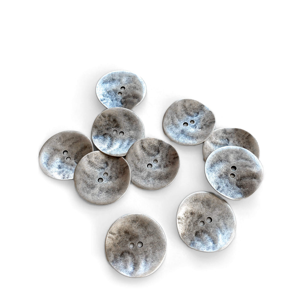 Large zinc undulating metal buttons